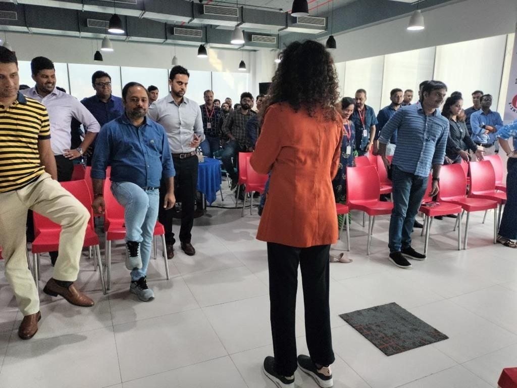 Dr Dalia leading exercise session at corporate office