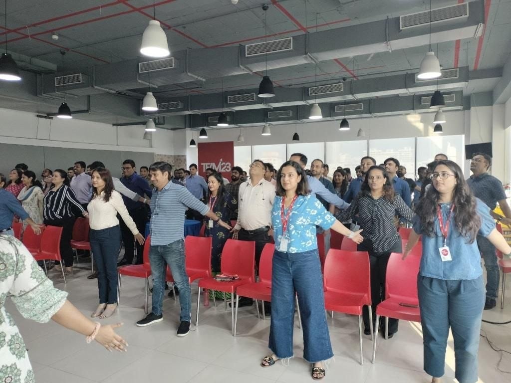 Employees stretching arms at D-Physio workplace health session